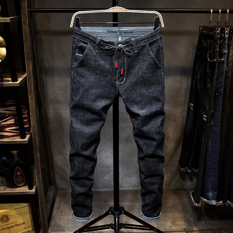 Musim gugur model baru celana jeans pria hitam Gaya Korea membentuk tubuh bertali Trendi Celana Pensil tali sepatu pasang anak muda panjang Celana