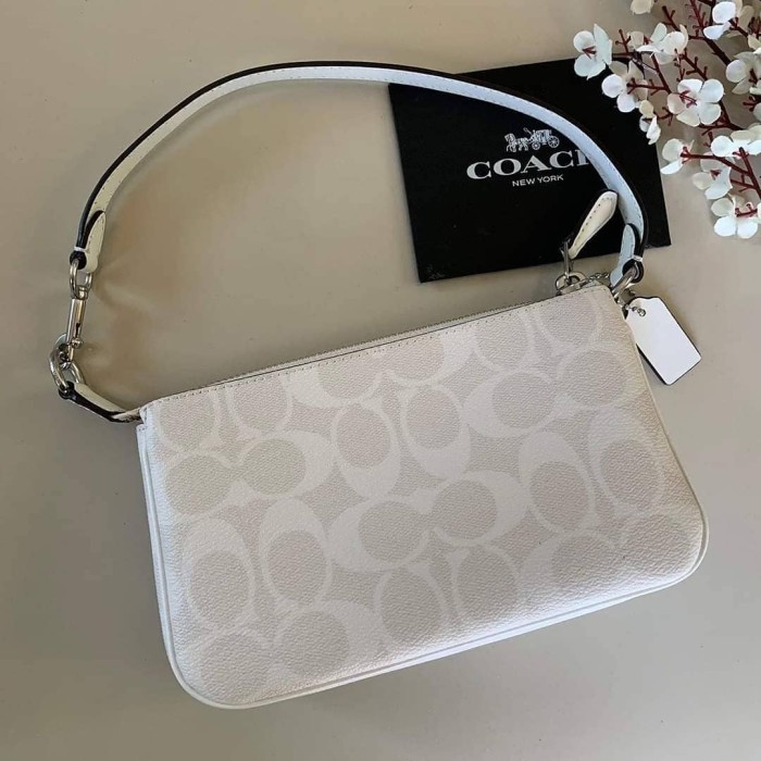 coach wristlet cream